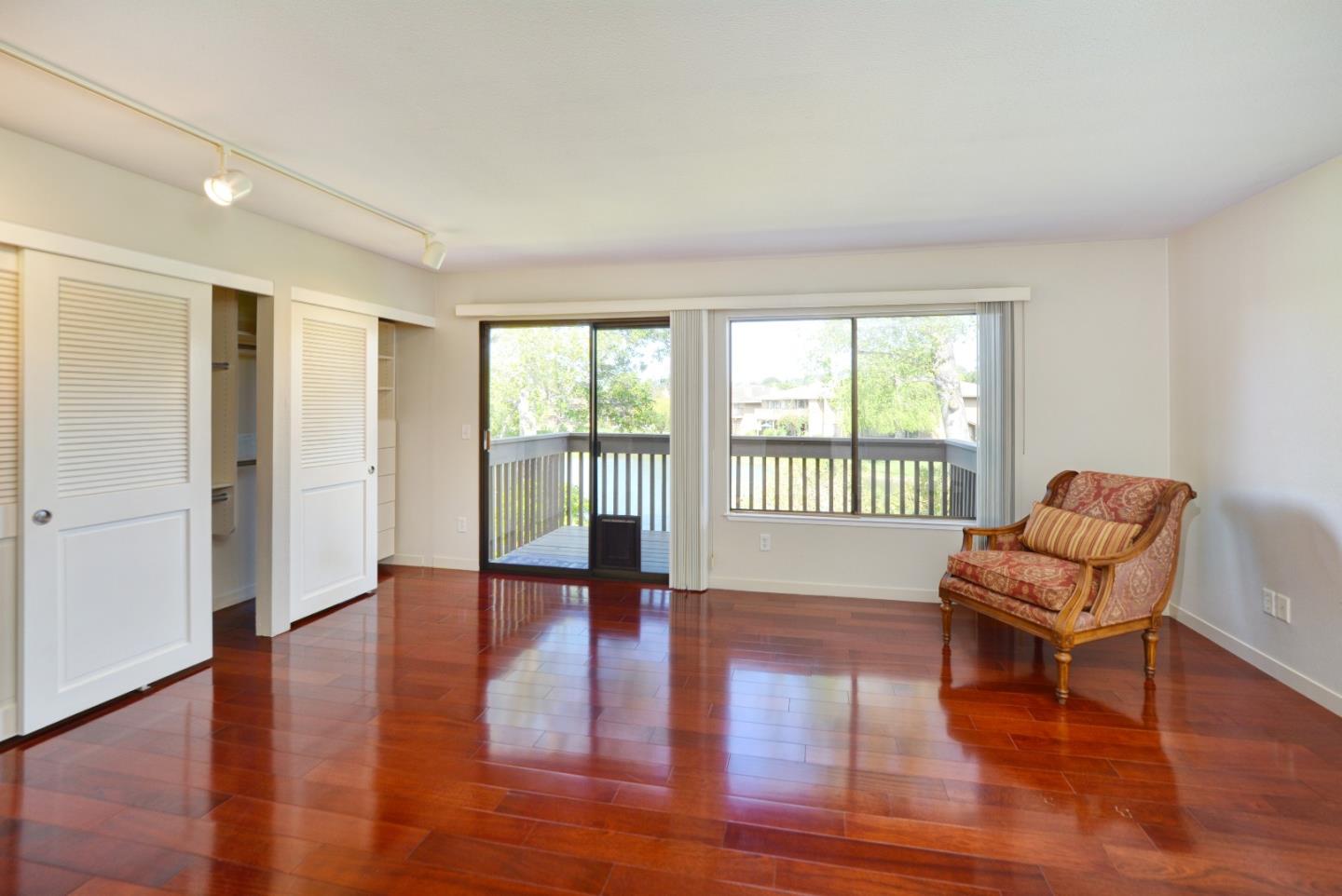 3850 Rio Road, Unit 40 Carmel, CA 93923 - Photo 19 of 28 a living room with furniture and a wooden floor