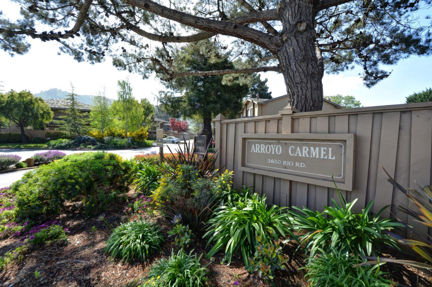 3850 Rio Road, Unit 40 Carmel, CA 93923 - Photo 2 of 28 a building with trees in front of it