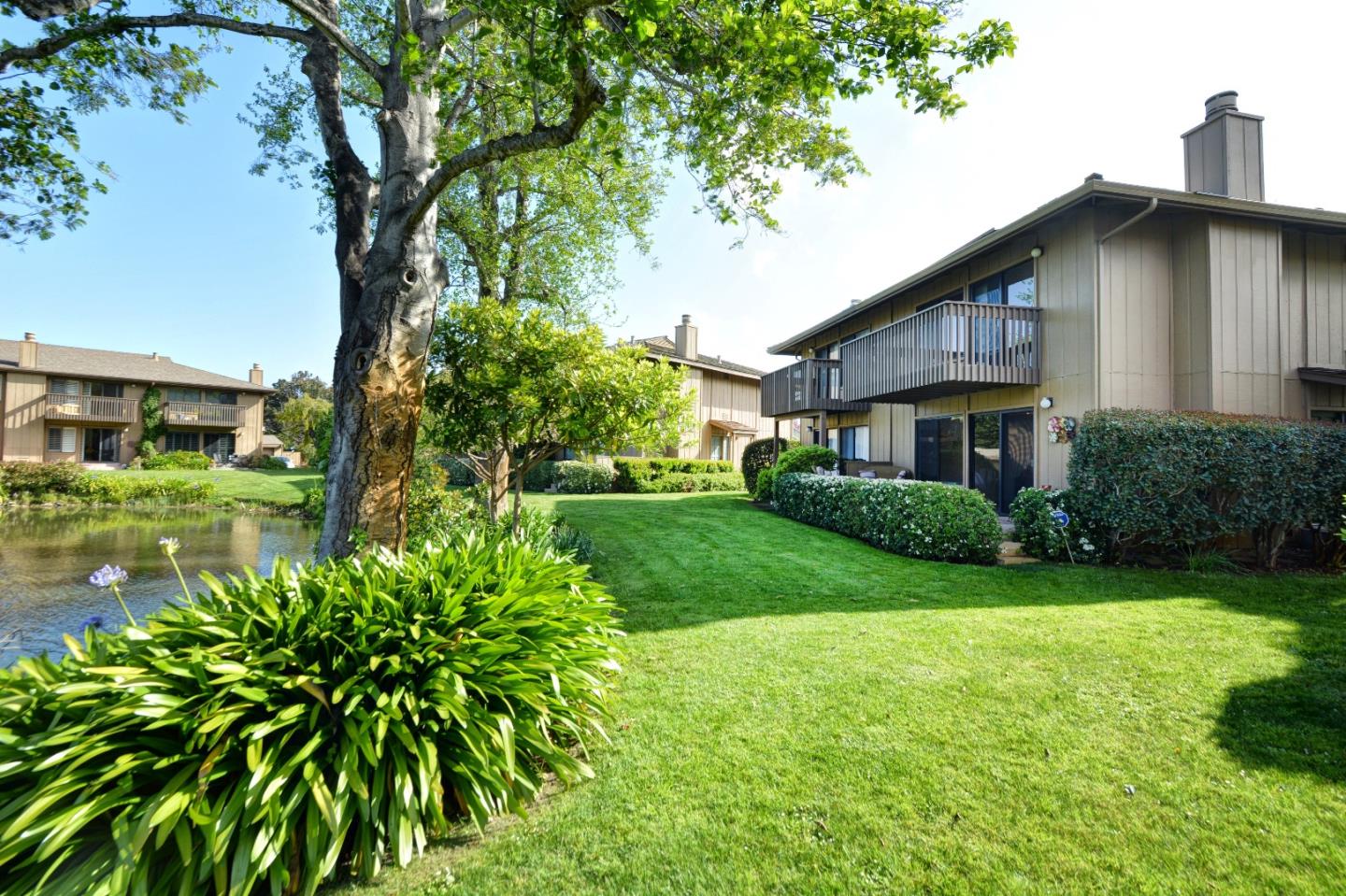 3850 Rio Road, Unit 40 Carmel, CA 93923 - Photo 24 of 28 a view of a house with a yard