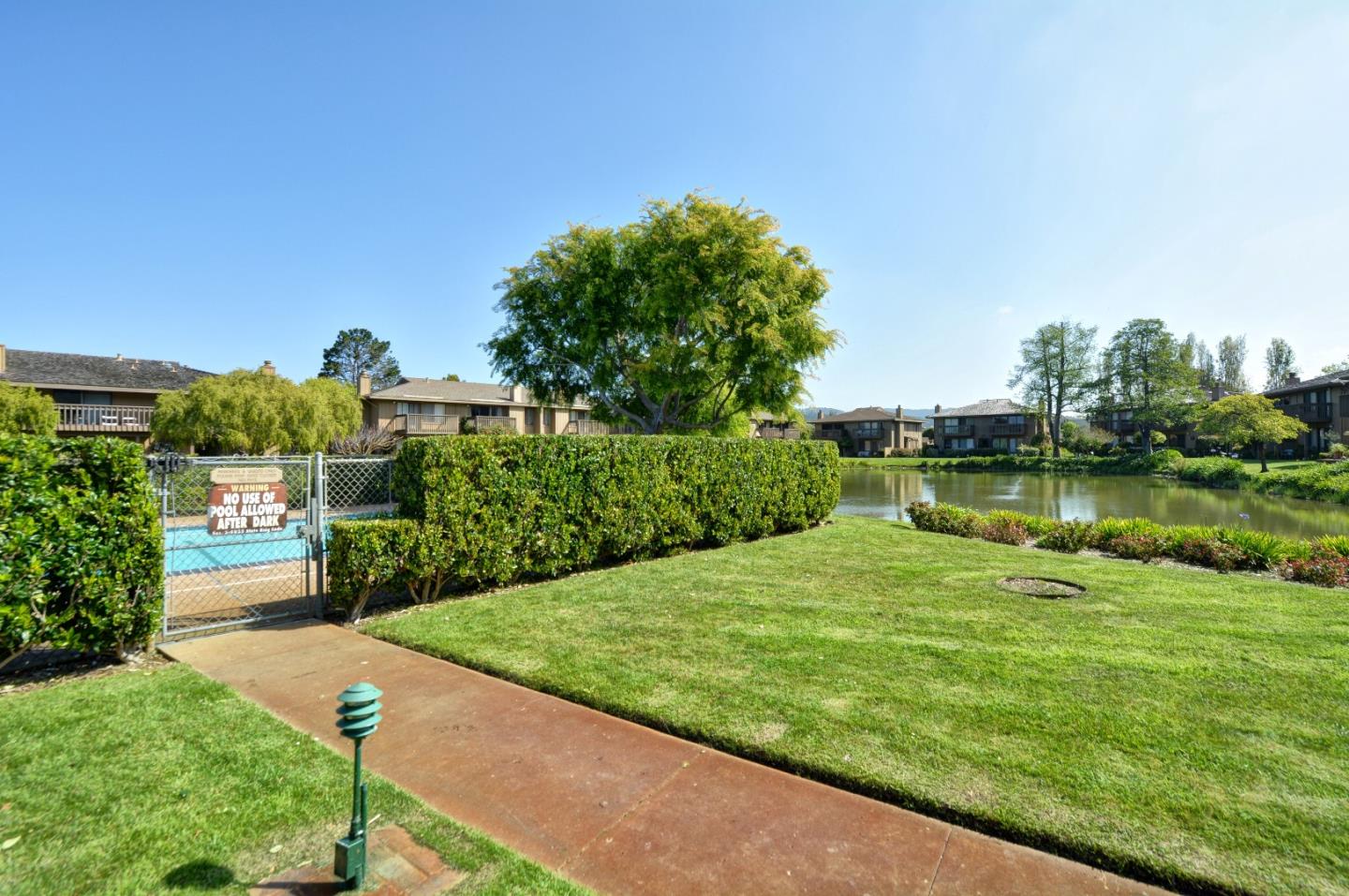 3850 Rio Road, Unit 40 Carmel, CA 93923 - Photo 28 of 28 a view of a garden with a lake view