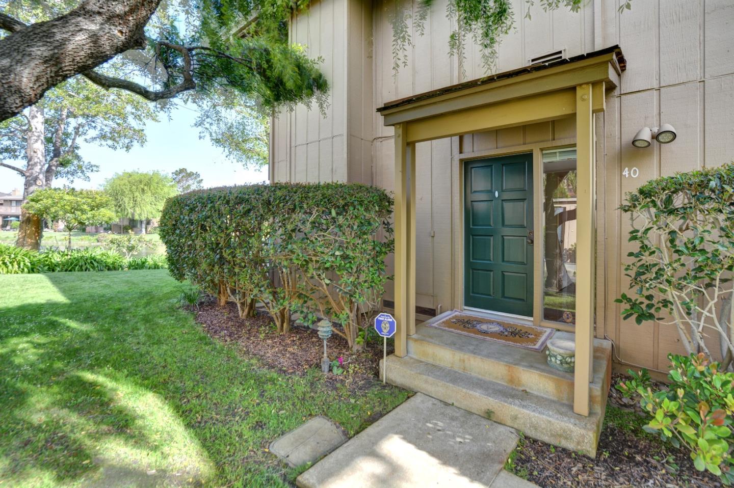 3850 Rio Road, Unit 40 Carmel, CA 93923 - Photo 3 of 28 a front view of a house with a yard