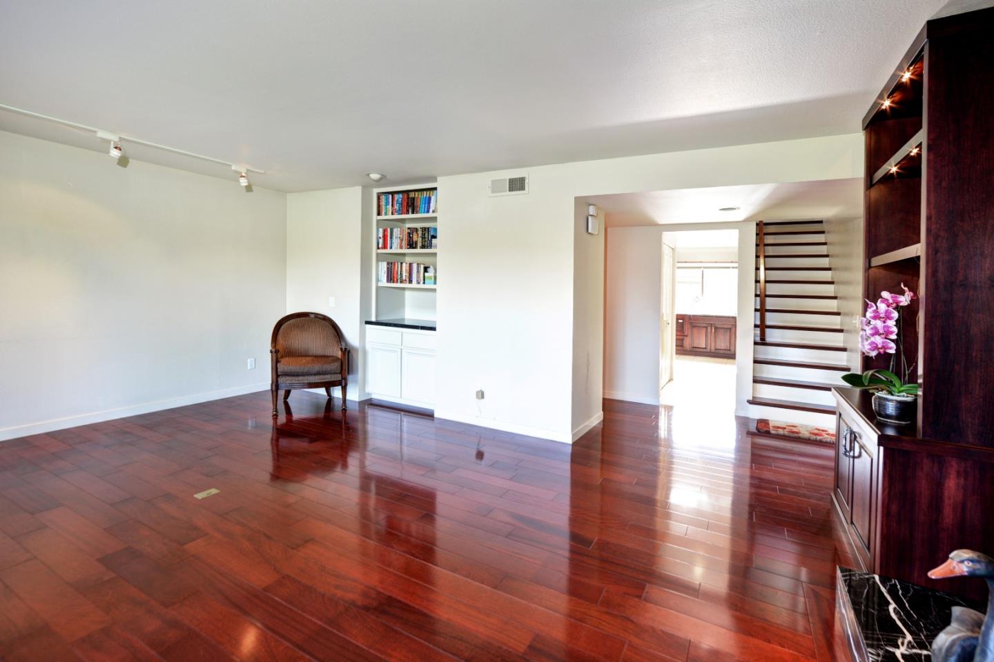3850 Rio Road, Unit 40 Carmel, CA 93923 - Photo 7 of 28 a view of empty room with wooden floor and fan