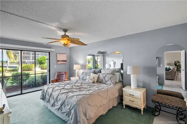 a bedroom with a bed and a view of bedroom