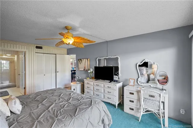 a bedroom with furniture and flat screen tv