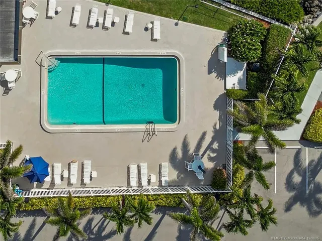 a kitchen with a sink a stove and a microwave