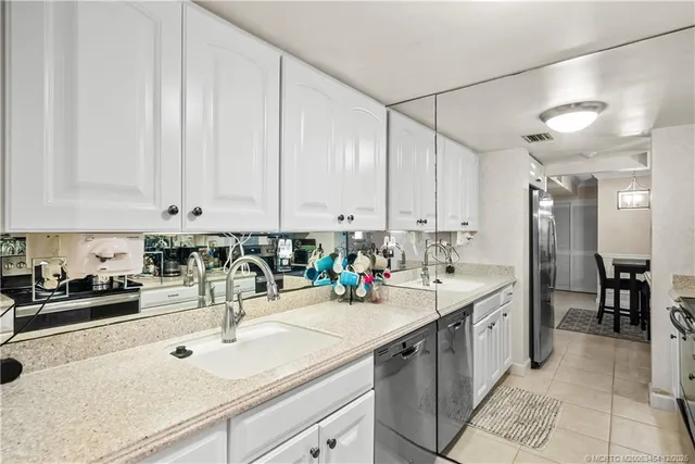 a kitchen with a sink and cabinets
