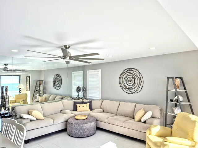 a living room with furniture and a rug