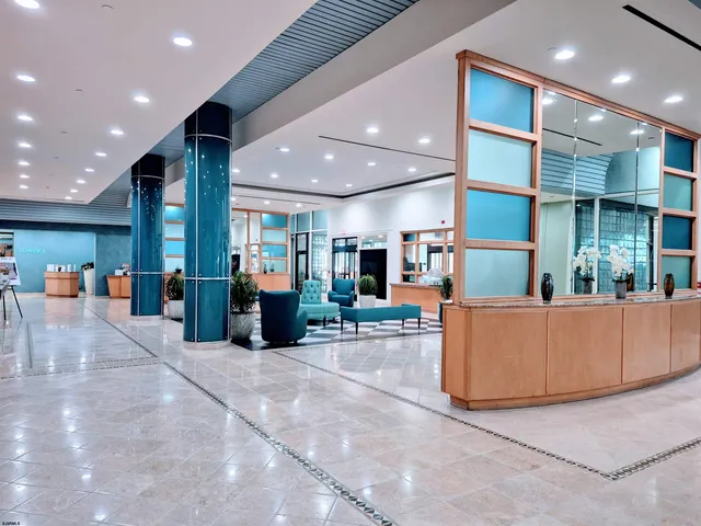 a living room with furniture a fireplace and a counter top space