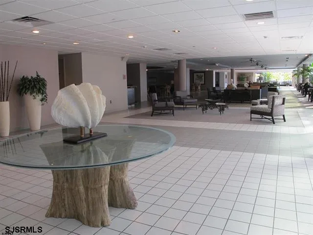 a living room with lots of furniture and a flat screen tv
