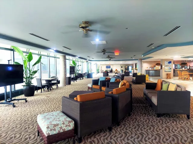 a view of a patio with dining table and chairs