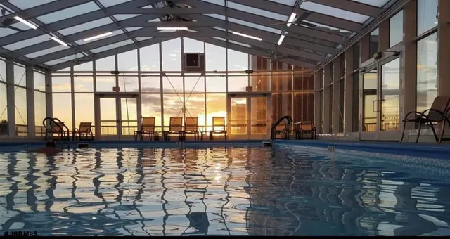 a view of a patio with chairs and tables