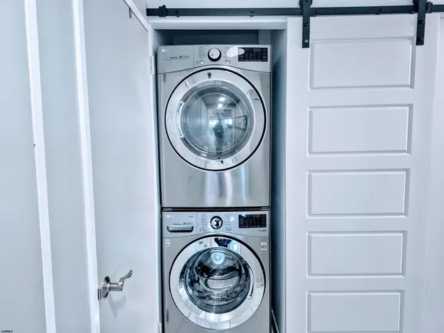 a kitchen with stainless steel appliances kitchen island granite countertop a refrigerator sink and stove