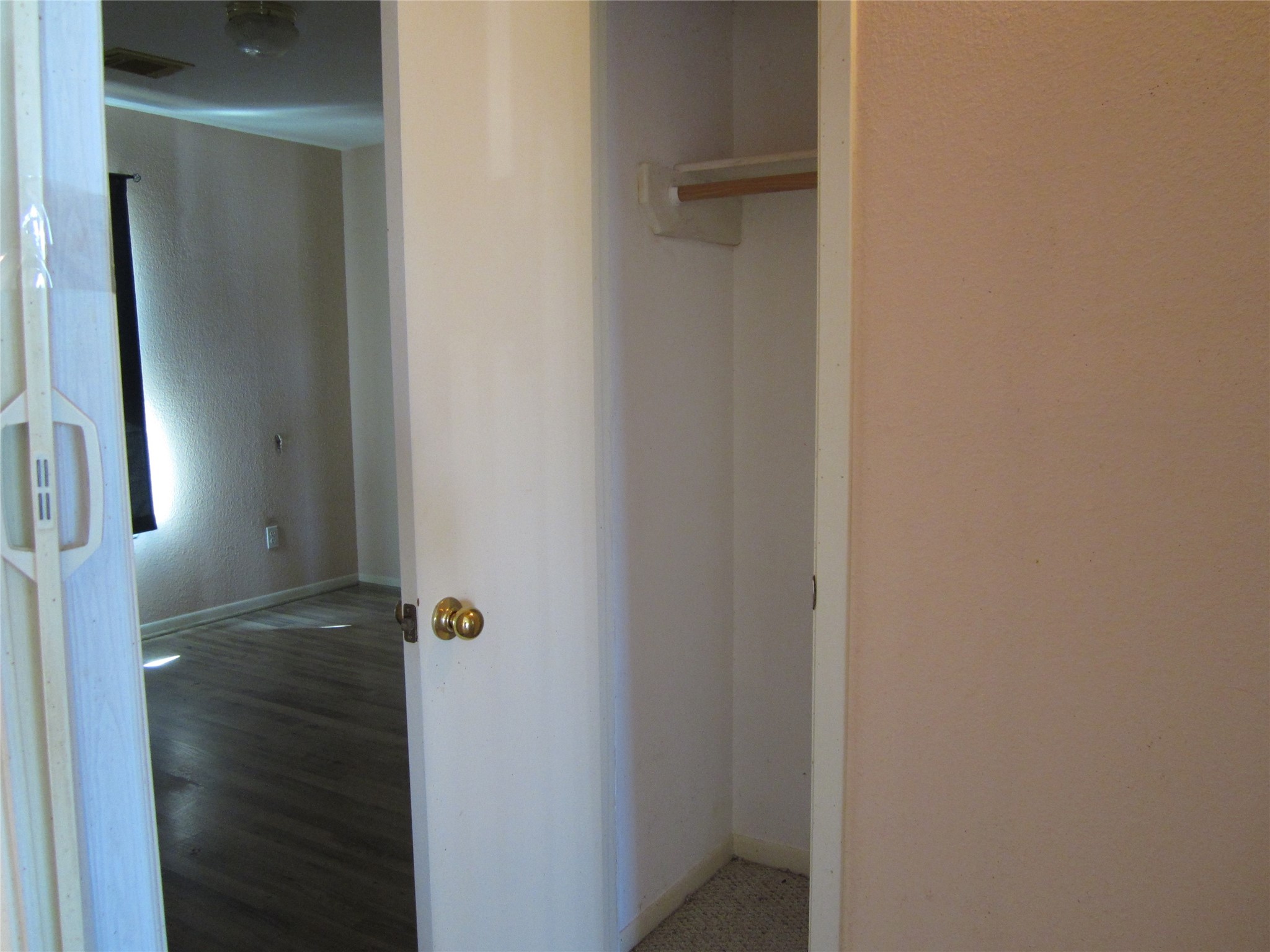 20697 Pierceall Road Hempstead, TX 77445 - Photo 28 of 35 Hallway on secondary bedroom side offers extra storage with two small closets one for hanging or storing items.