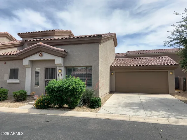 a front view of a house with a garage