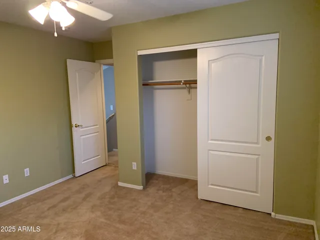 a bathroom with a double vanity sink toilet and shower