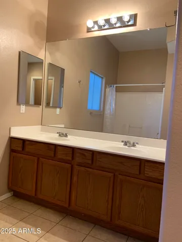 a bathroom with a shower and a bath tub