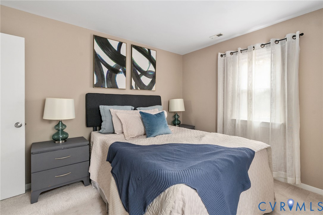 10324 Natural Bridge Road Chesterfield, VA 23236 - Photo 12 of 31 a bedroom with a bed and a painting on the wall