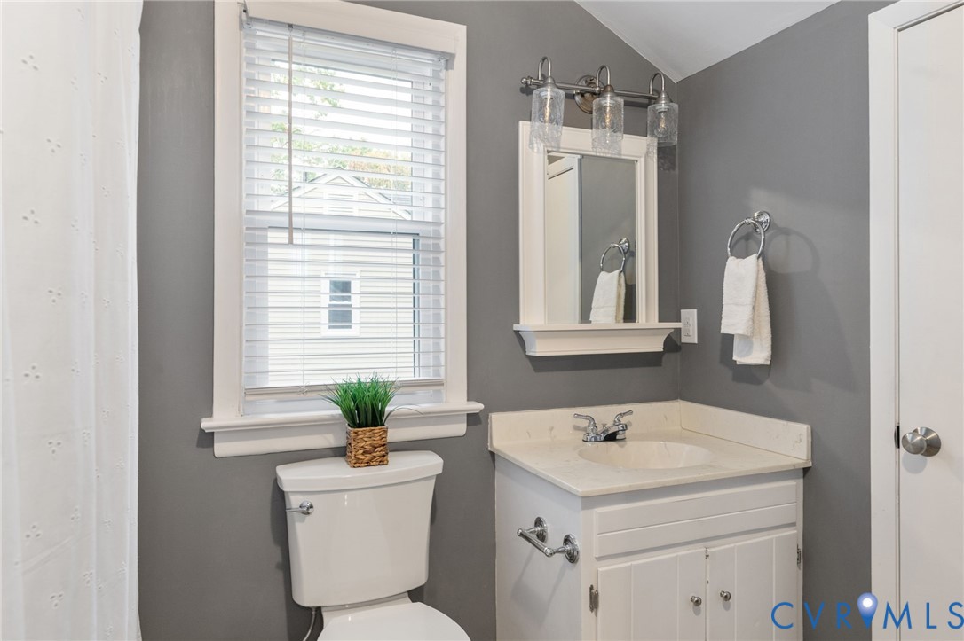 10324 Natural Bridge Road Chesterfield, VA 23236 - Photo 17 of 31 a bathroom with a sink a toilet and a mirror