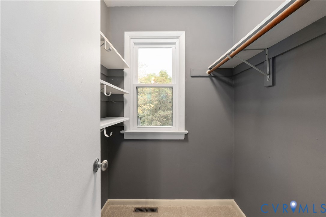 10324 Natural Bridge Road Chesterfield, VA 23236 - Photo 19 of 31 a bathroom with a window sink and shower