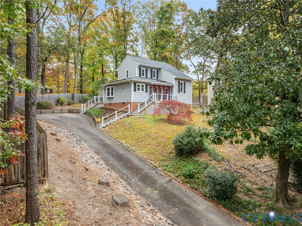 10324 Natural Bridge Road Chesterfield, VA 23236 - Photo 25 of 31 a view of a big house with large trees and plants