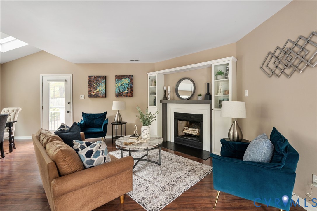 10324 Natural Bridge Road Chesterfield, VA 23236 - Photo 6 of 31 a living room with furniture and a fireplace