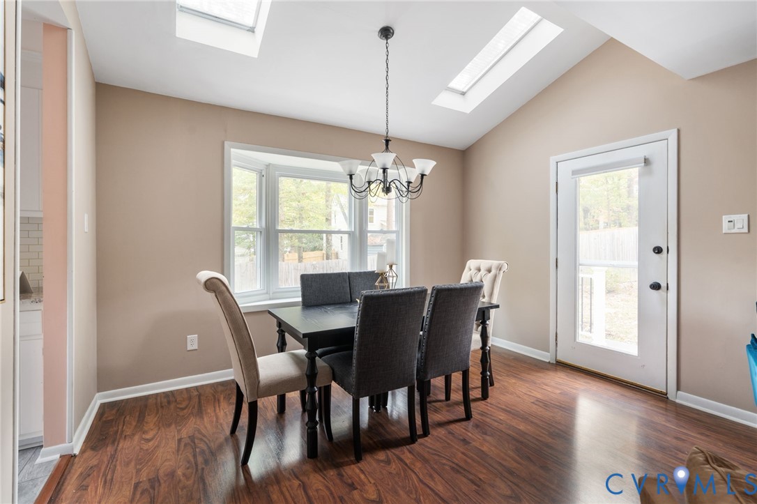 10324 Natural Bridge Road Chesterfield, VA 23236 - Photo 9 of 31 a view of a dining room with furniture window and wooden floor