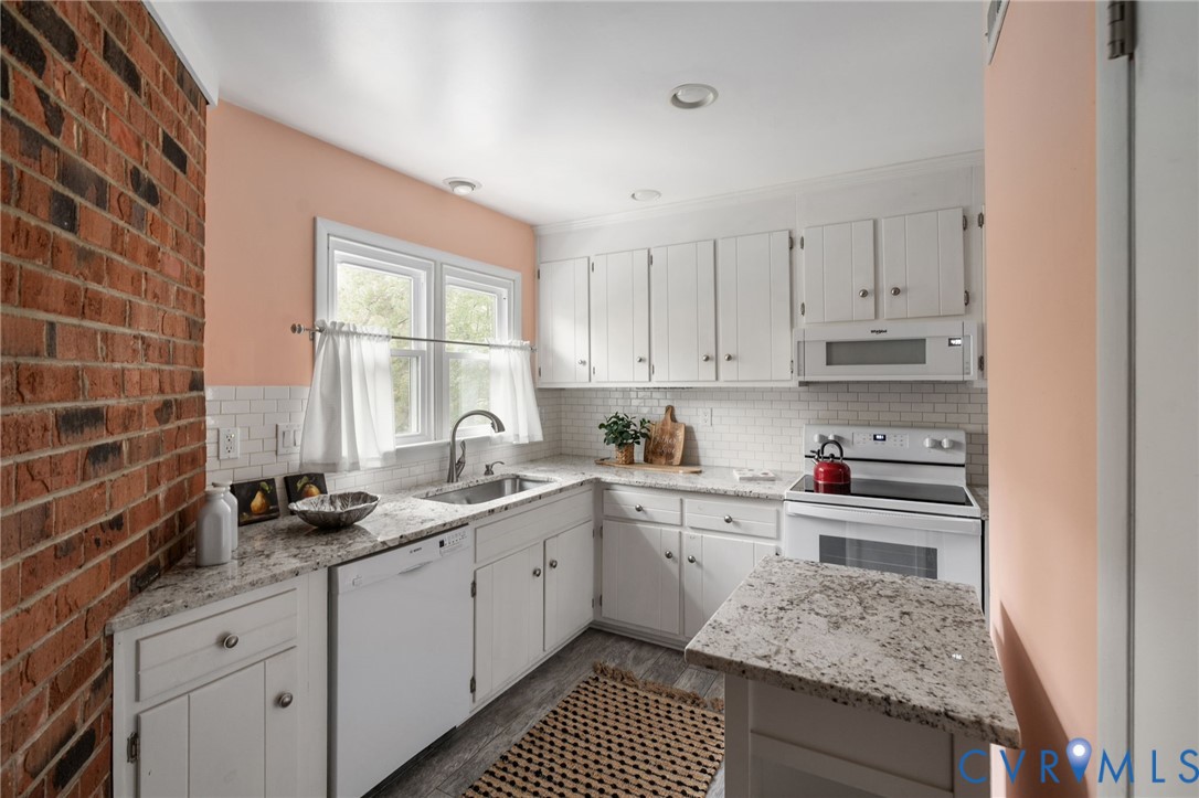 10324 Natural Bridge Road Chesterfield, VA 23236 - Photo 10 of 31 a kitchen with a sink stove and cabinets
