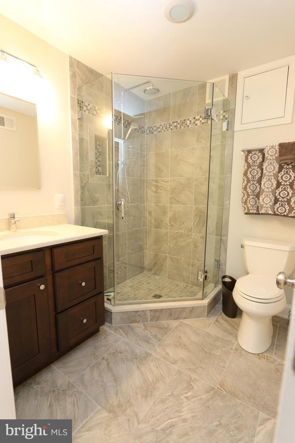 1583 Inlet Court Reston, VA 20190 - Photo 21 of 30 a bathroom with a sink a toilet and shower