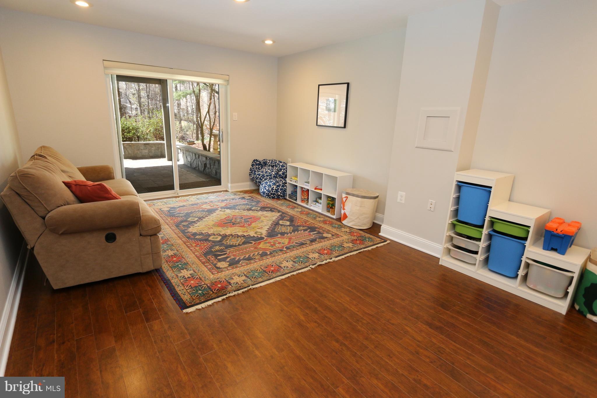 1583 Inlet Court Reston, VA 20190 - Photo 22 of 30 a bedroom with a bed and wooden floor