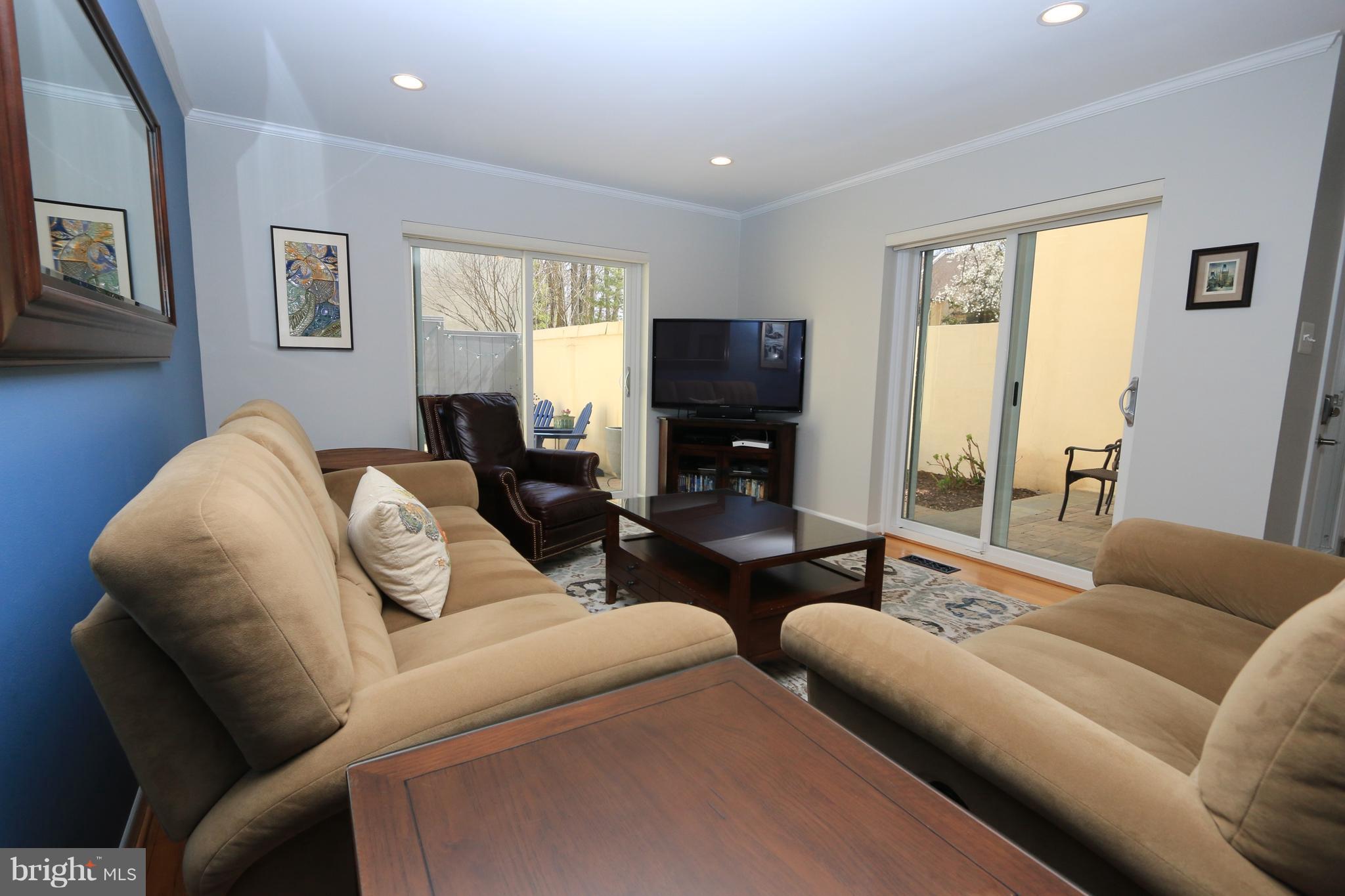 1583 Inlet Court Reston, VA 20190 - Photo 5 of 30 a living room with furniture and a flat screen tv