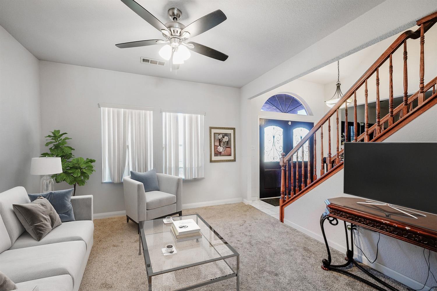 19360 Maple Street Laton, CA 93242 - Photo 11 of 53 a living room with furniture and a window