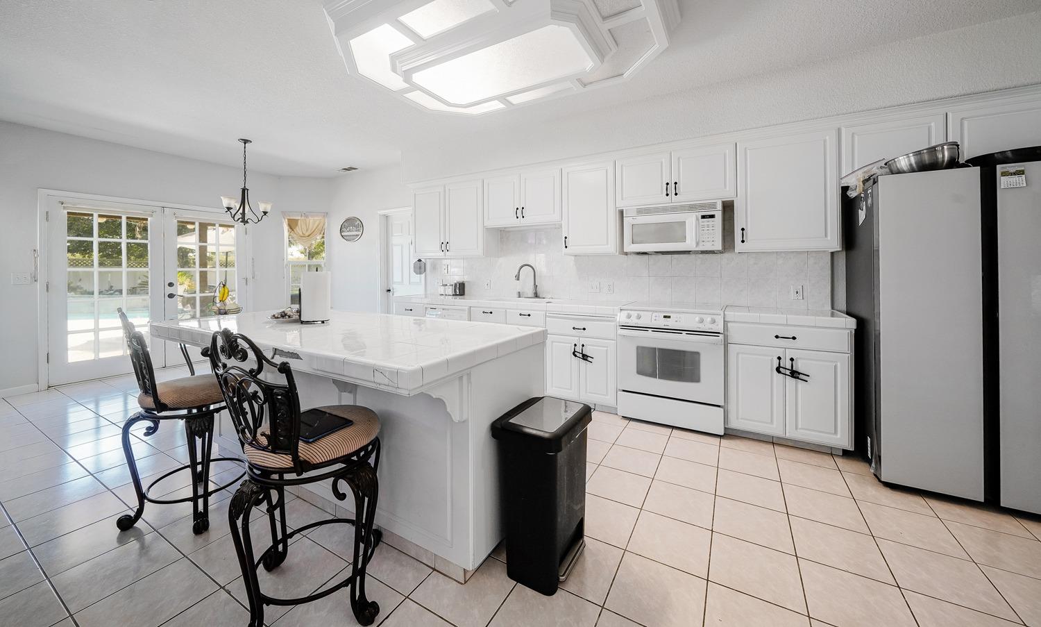 19360 Maple Street Laton, CA 93242 - Photo 15 of 53 a kitchen with appliances cabinets and furniture