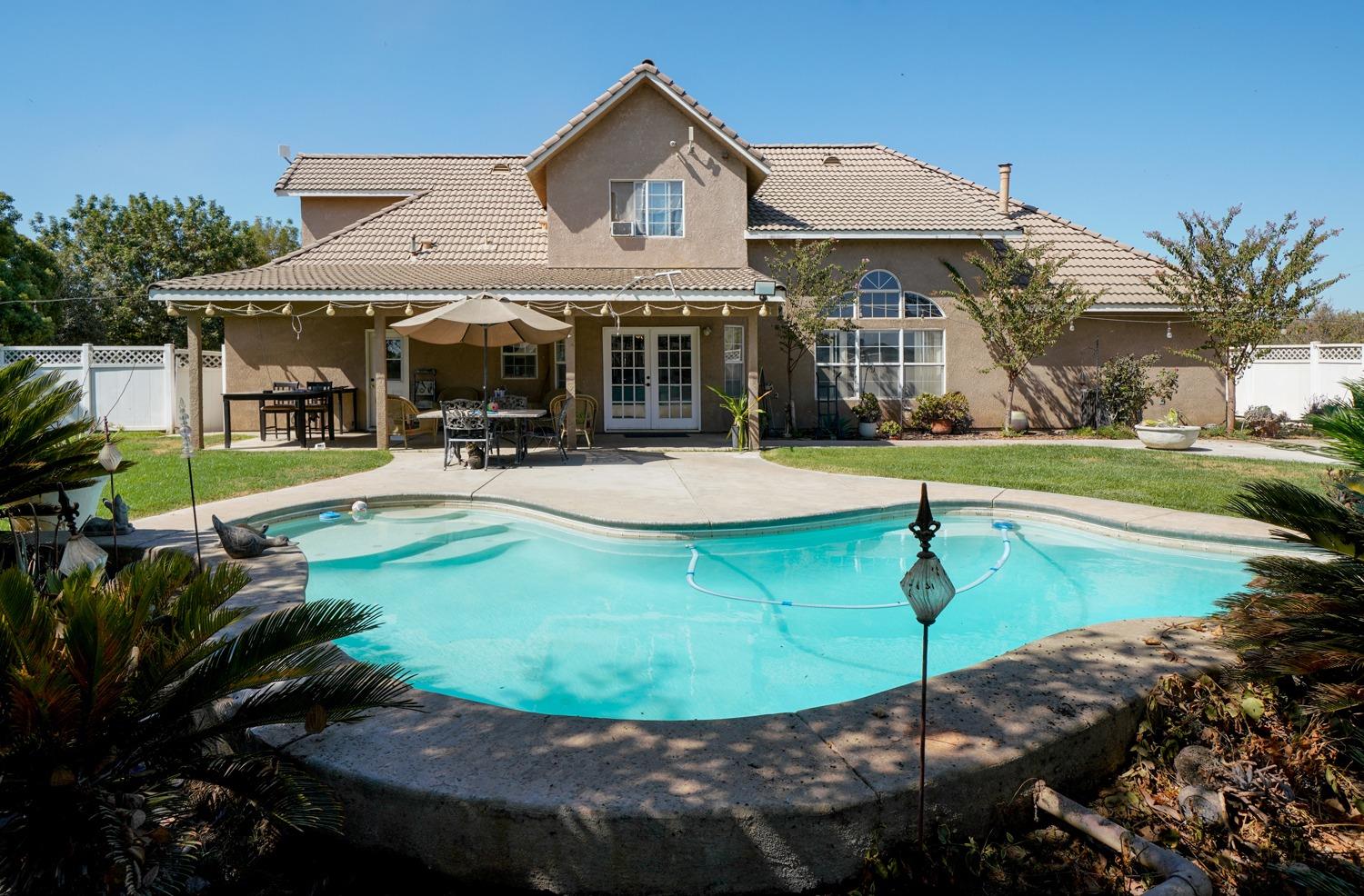 19360 Maple Street Laton, CA 93242 - Photo 2 of 53 a view of a house with entertaining space