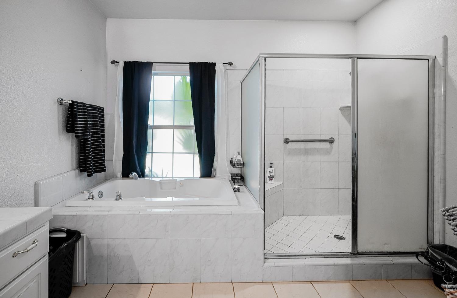 19360 Maple Street Laton, CA 93242 - Photo 23 of 53 a bathroom with a bathtub and a sink