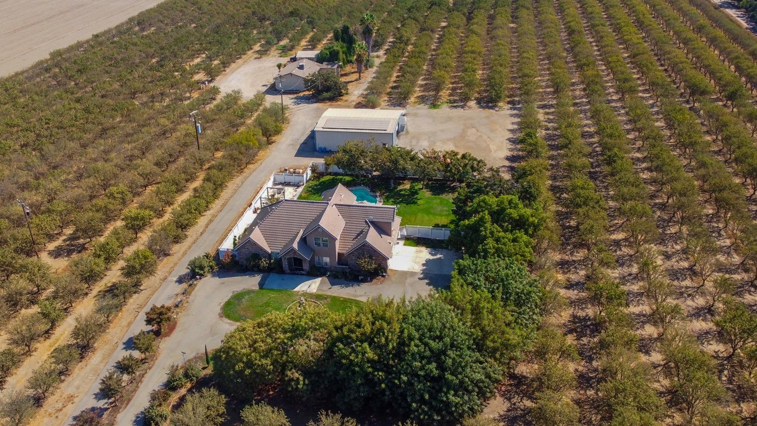 19360 Maple Street Laton, CA 93242 - Photo 3 of 53 a view of a house with a yard