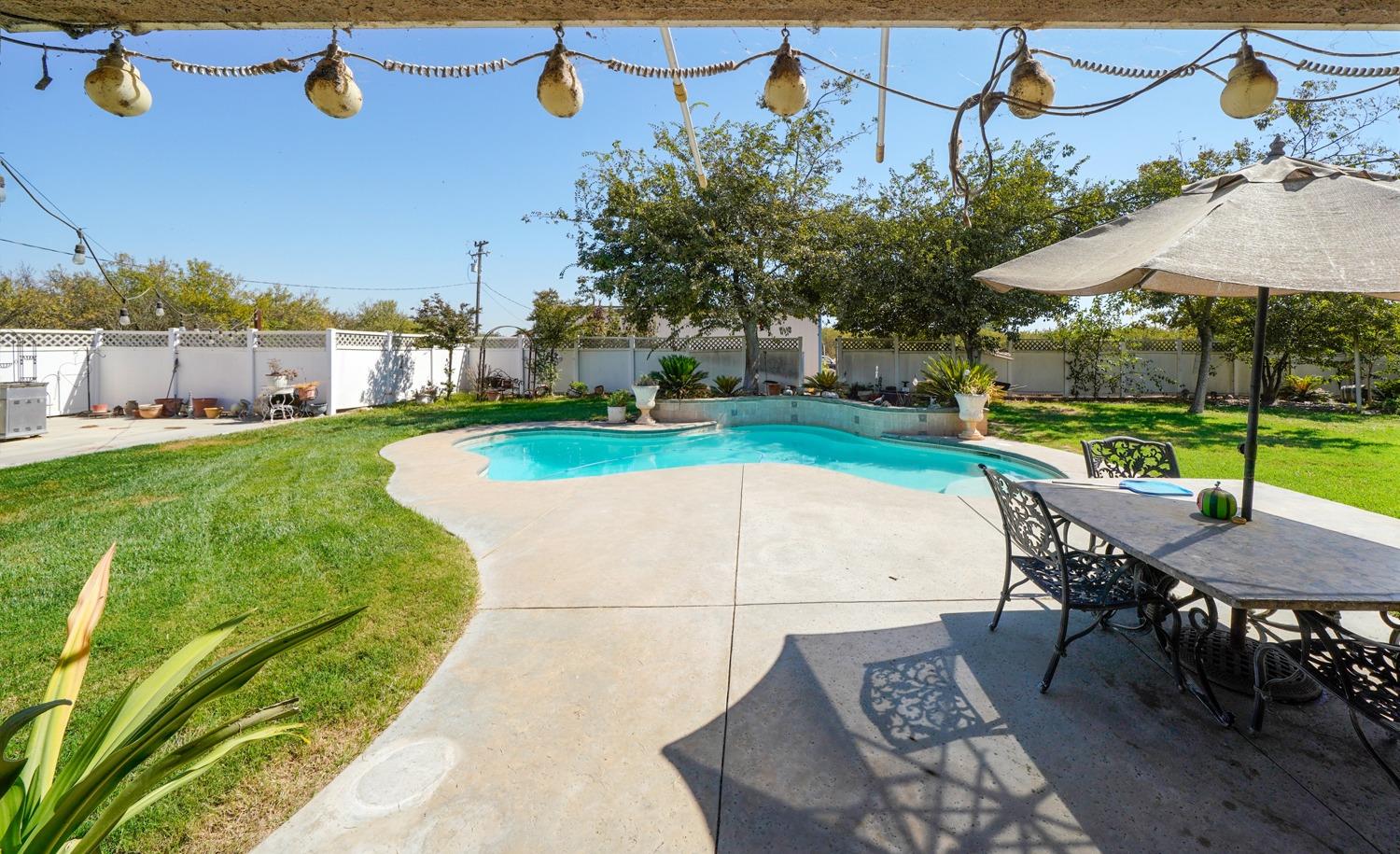 19360 Maple Street Laton, CA 93242 - Photo 33 of 53 an outdoor space with furniture and garden