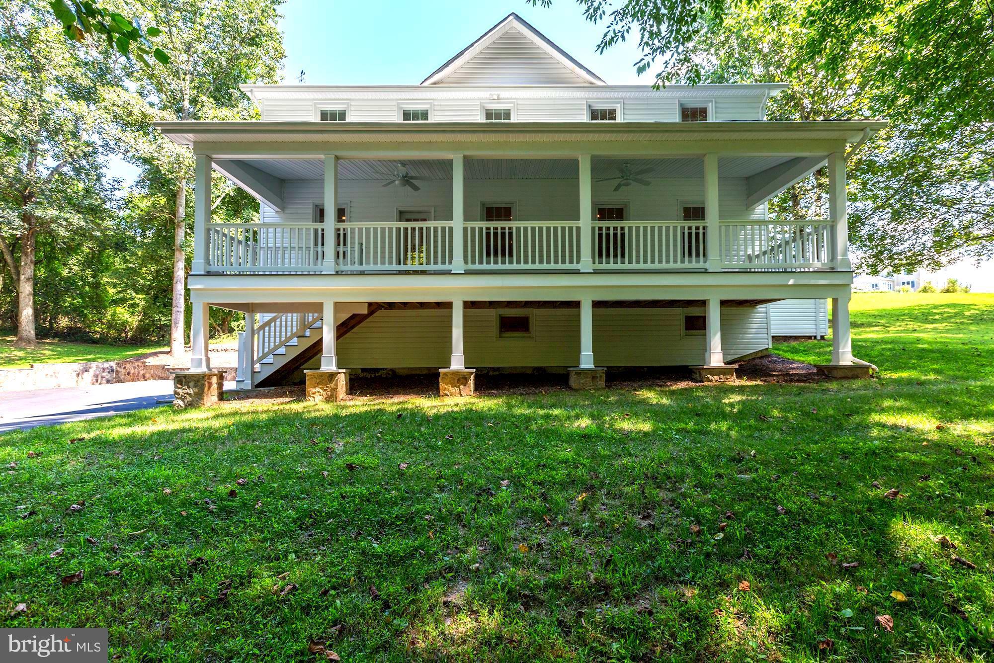 8061 Browns Bridge Road Fulton, MD 20759 - Photo 2 of 22 Private front deck overlooking blooming trees