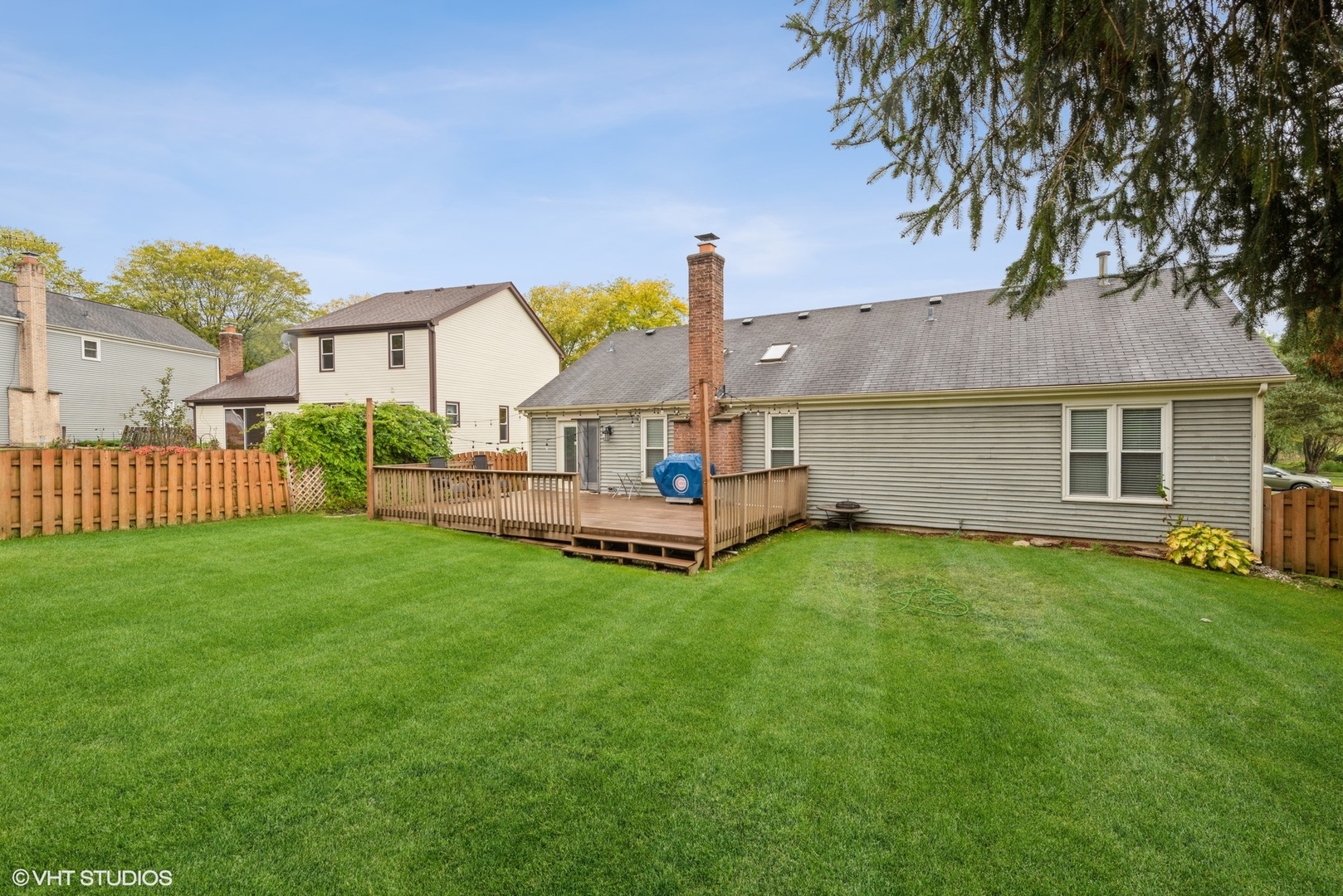 267 Foxmoor Road Fox River Grove, IL 60021 - Photo 21 of 22 a view of backyard of house with wooden deck and seating space