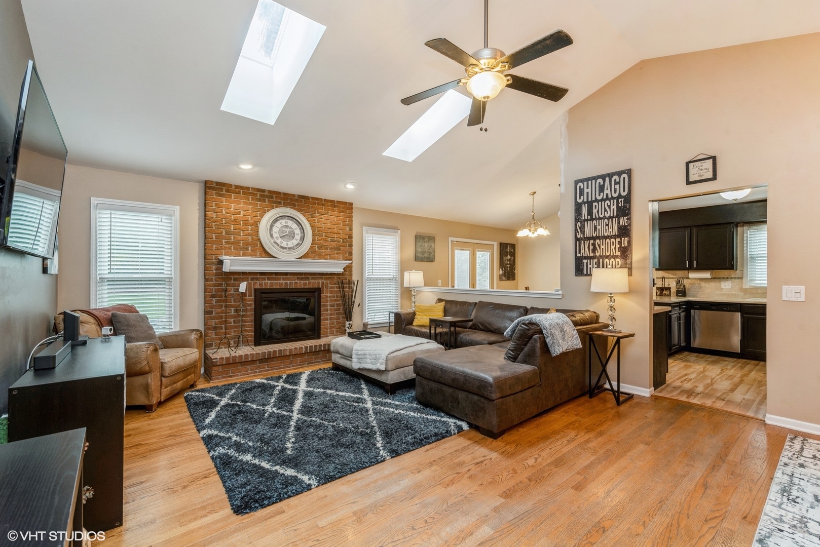 267 Foxmoor Road Fox River Grove, IL 60021 - Photo 3 of 22 a living room with furniture a fireplace and a flat screen tv