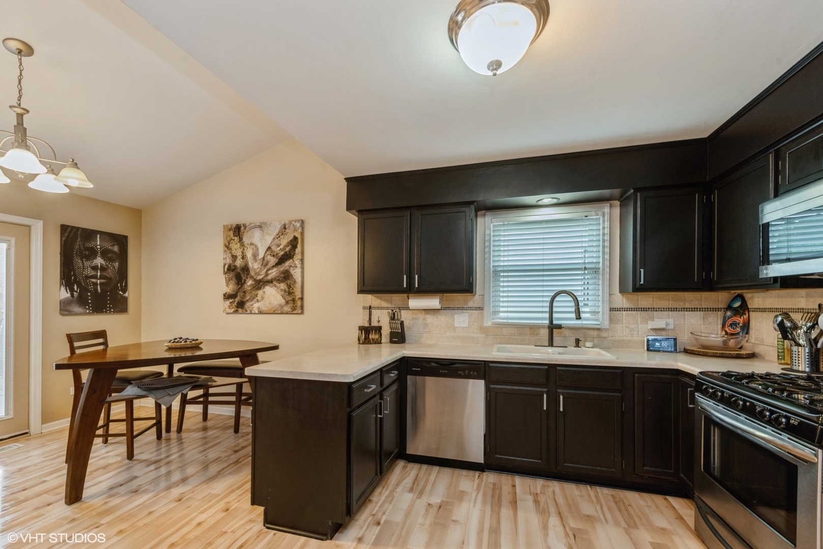 267 Foxmoor Road Fox River Grove, IL 60021 - Photo 5 of 22 a kitchen with a sink a stove and cabinets