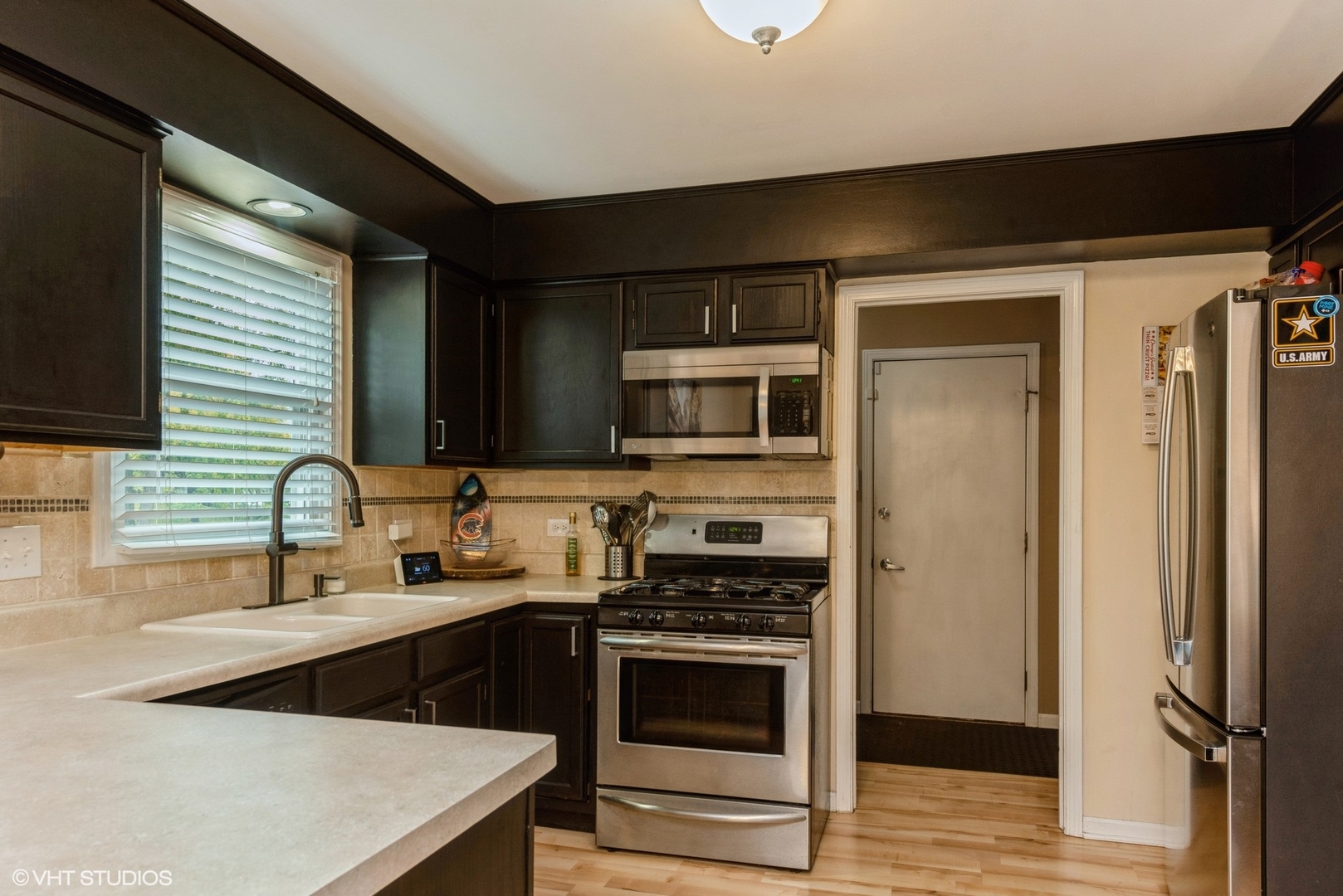 267 Foxmoor Road Fox River Grove, IL 60021 - Photo 7 of 22 a kitchen with stainless steel appliances a stove sink and microwave