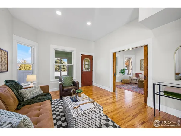 a living room with furniture or couch and a table