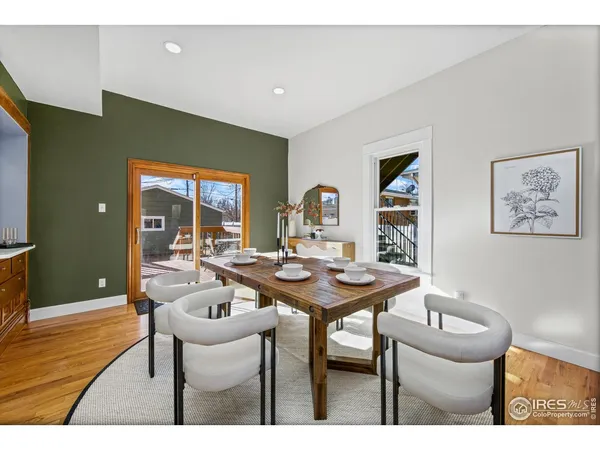 a outdoor dining space with furniture and kitchen view