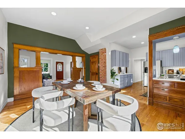 a kitchen with granite countertop a refrigerator stove top oven and sink