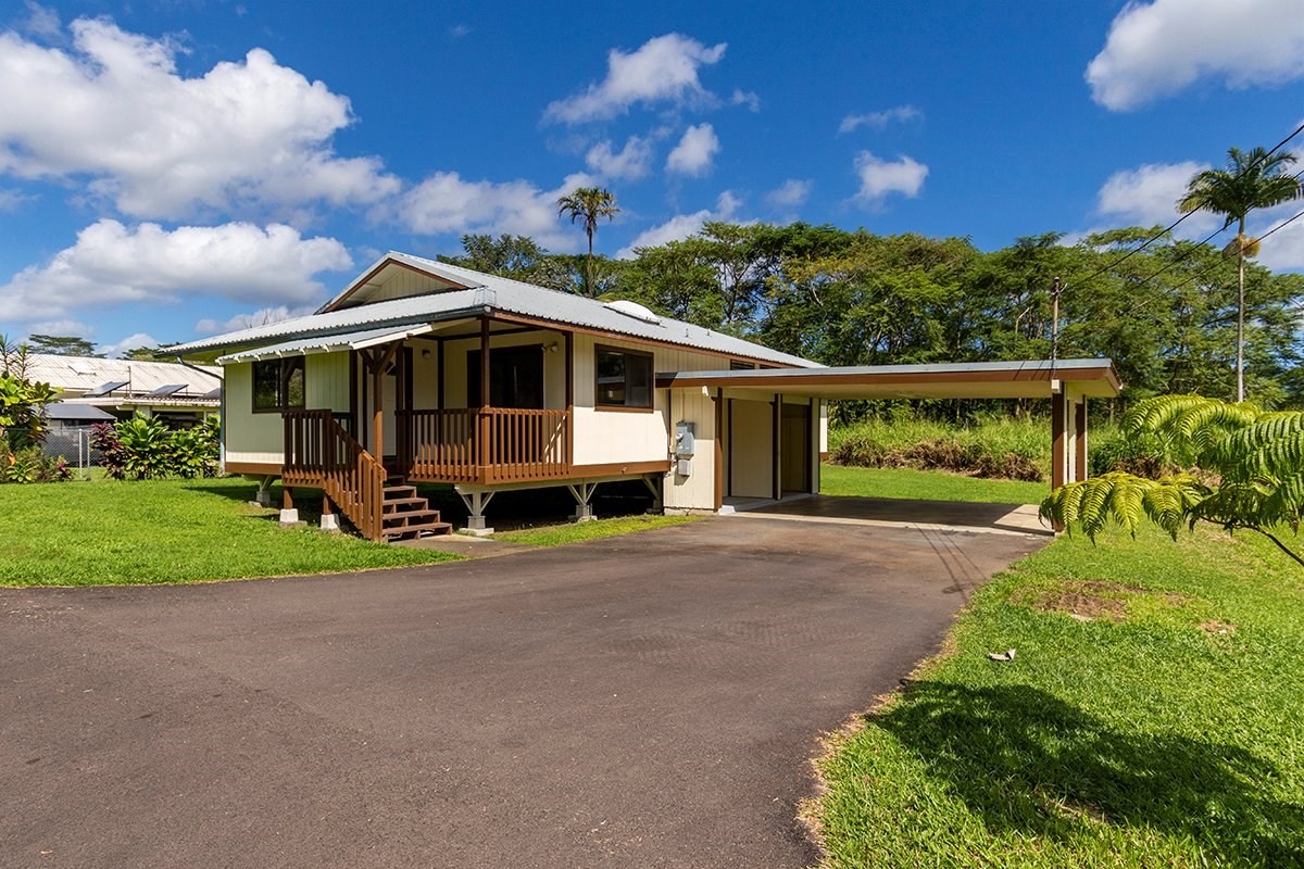 17-4018 Kuaaina Road, Unit 105 Kurtistown, HI 96749 - Photo 1 of 22 a view of a house with backyard and garden