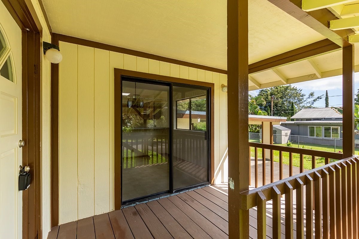 17-4018 Kuaaina Road, Unit 105 Kurtistown, HI 96749 - Photo 11 of 22 a view of a porch with wooden floor and furniture