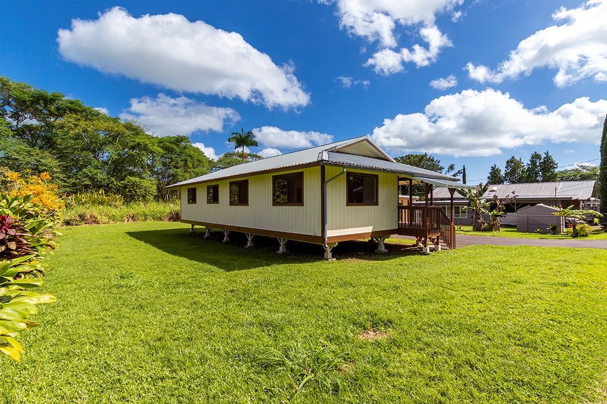 17-4018 Kuaaina Road, Unit 105 Kurtistown, HI 96749 - Photo 13 of 22 a view of a house with a yard