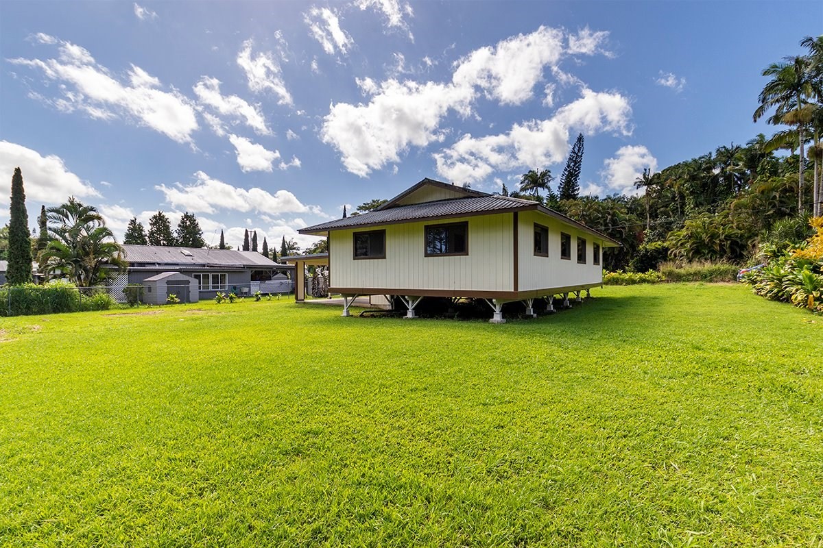 17-4018 Kuaaina Road, Unit 105 Kurtistown, HI 96749 - Photo 15 of 22 a view of a house with a big yard