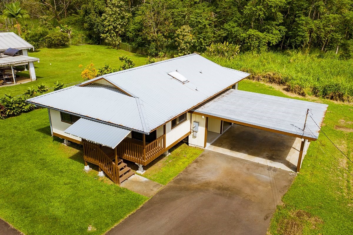 17-4018 Kuaaina Road, Unit 105 Kurtistown, HI 96749 - Photo 16 of 22 an aerial view of a house with a yard