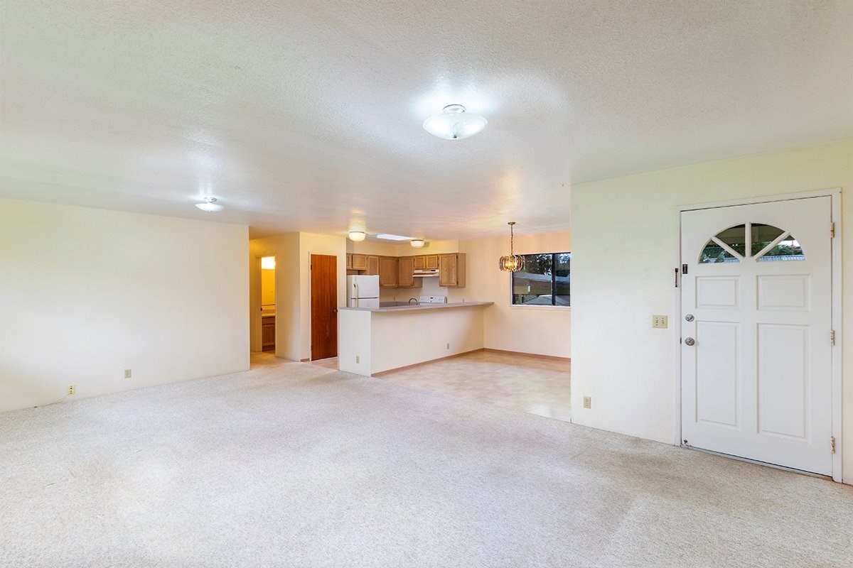 17-4018 Kuaaina Road, Unit 105 Kurtistown, HI 96749 - Photo 2 of 22 an empty room with a empty space and windows